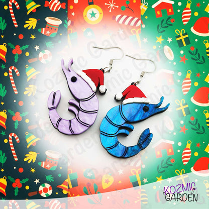 Shrimp-shaped earrings with Santa hats on a festive background with Christmas-themed decorations.