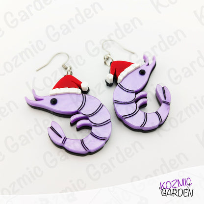 Purple shrimp earrings with Santa hats on a white background with 'Kozmic Garden' branding.