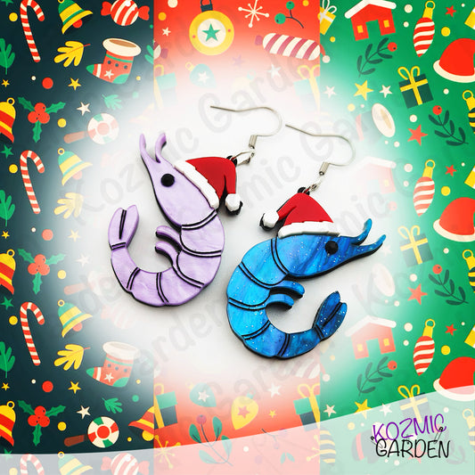 Shrimp-shaped earrings with Santa hats on a festive background with Christmas-themed decorations.