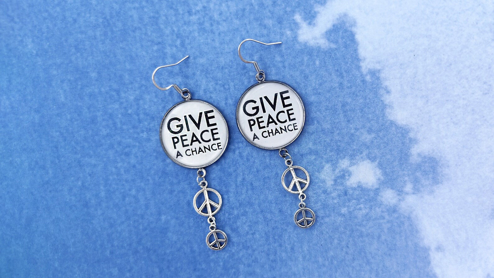 Give peace a chance earrings with blue background