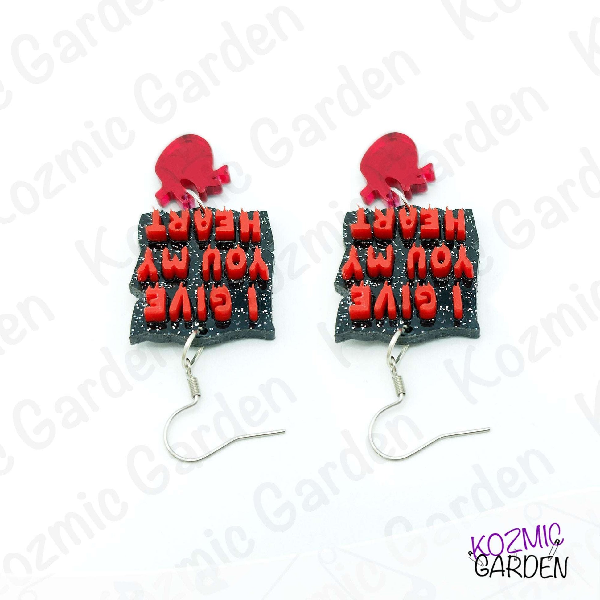 Earrings with red heat designs and text on a white background with 'Kozmic Garden' branding.
