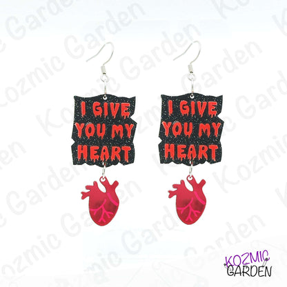 Earrings with 'I Give You My Heart' text and red heart design on a white background with brand name.