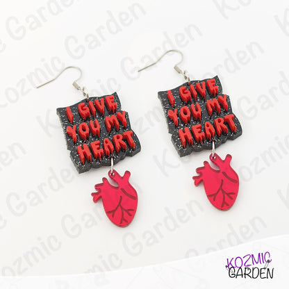 Earrings with 'I Give You My Heart' text and red heart design on a white background.
