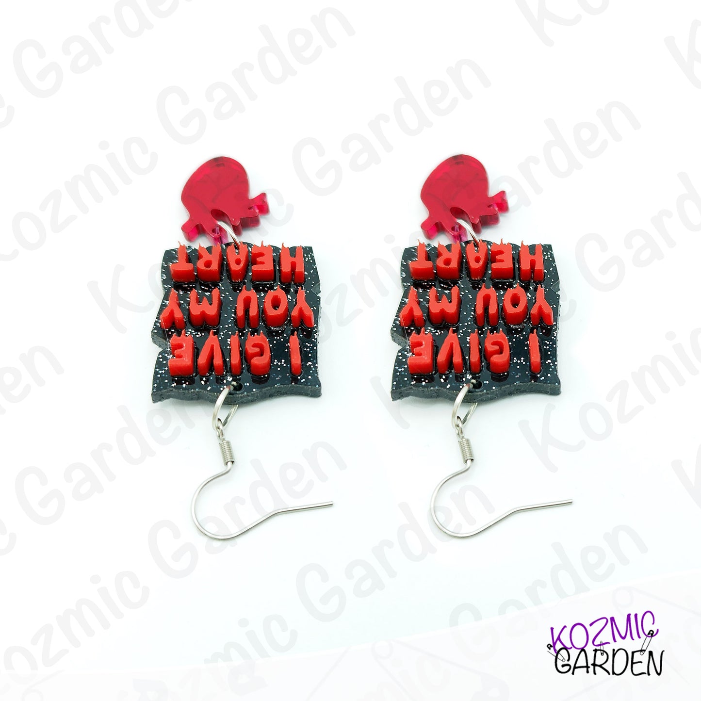 Earrings with red heat designs and text on a white background with 'Kozmic Garden' branding.