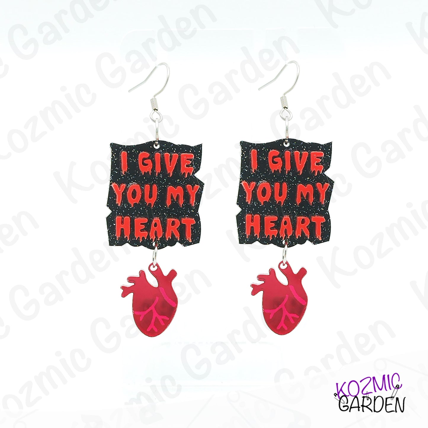 Earrings with 'I Give You My Heart' text and red heart design on a white background with brand name.