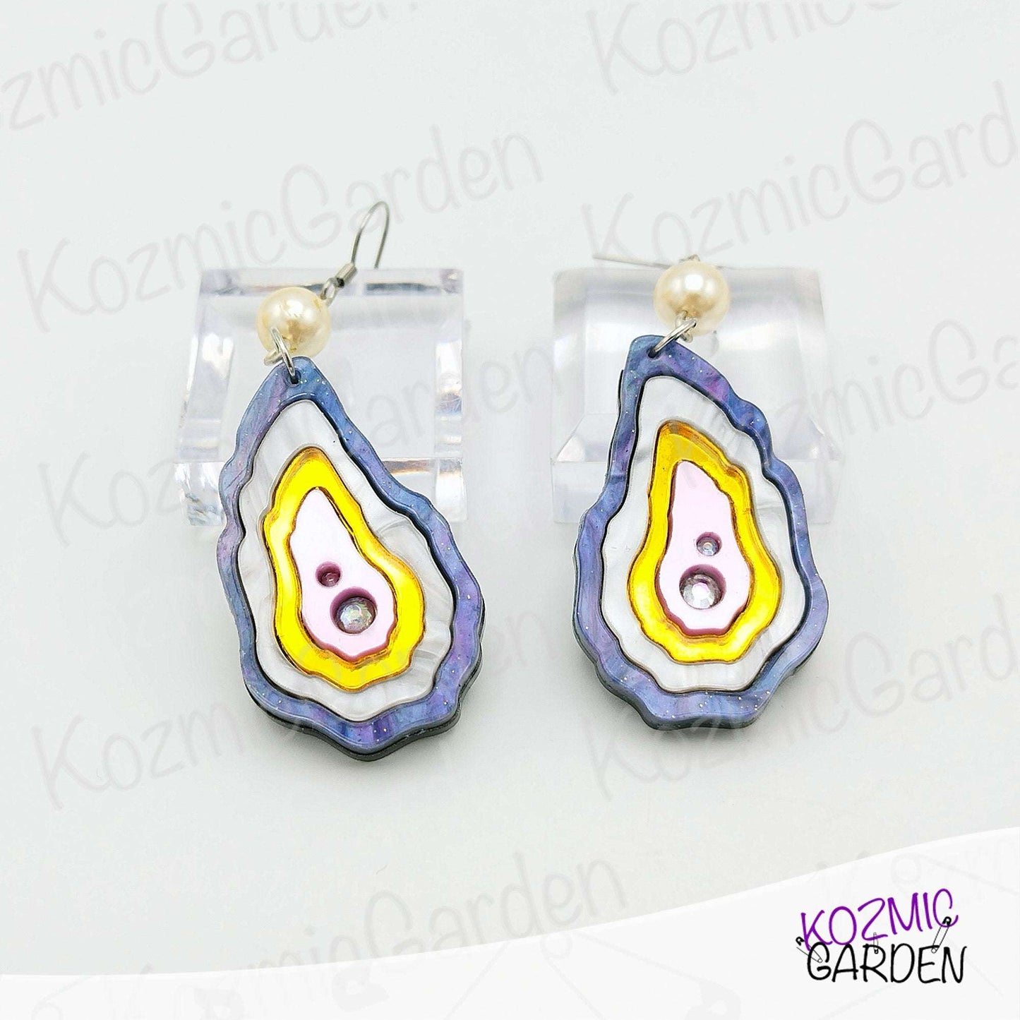 Unique handmade oyster shell earrings featuring rhinestone pearl detail