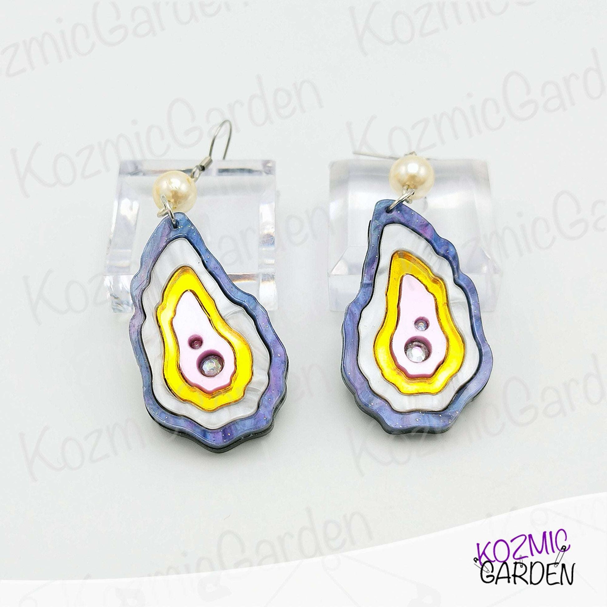 Unique handmade oyster shell earrings featuring rhinestone pearl detail