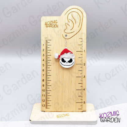 Spooky Christmas earrings worn on ear. Fun gothic holiday accessory for fans of dark, alternative fashion and Halloween lovers.
