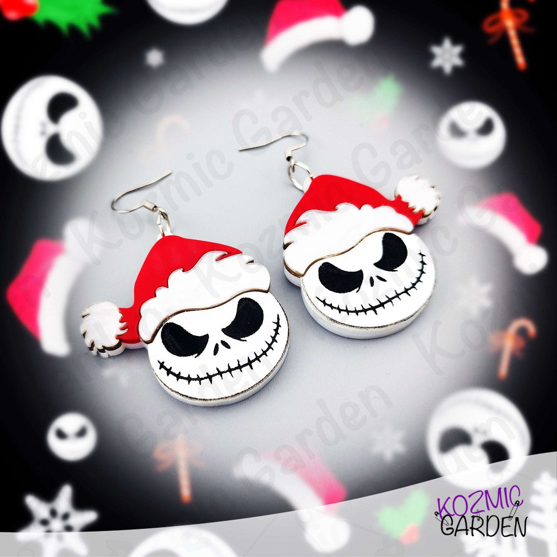 Handmade acrylic earrings featuring a Jack Skellington wearing a Santa hat, inspired by a Halloween and Christmas mashup. Festive gothic jewelry by Kozmic Garden.