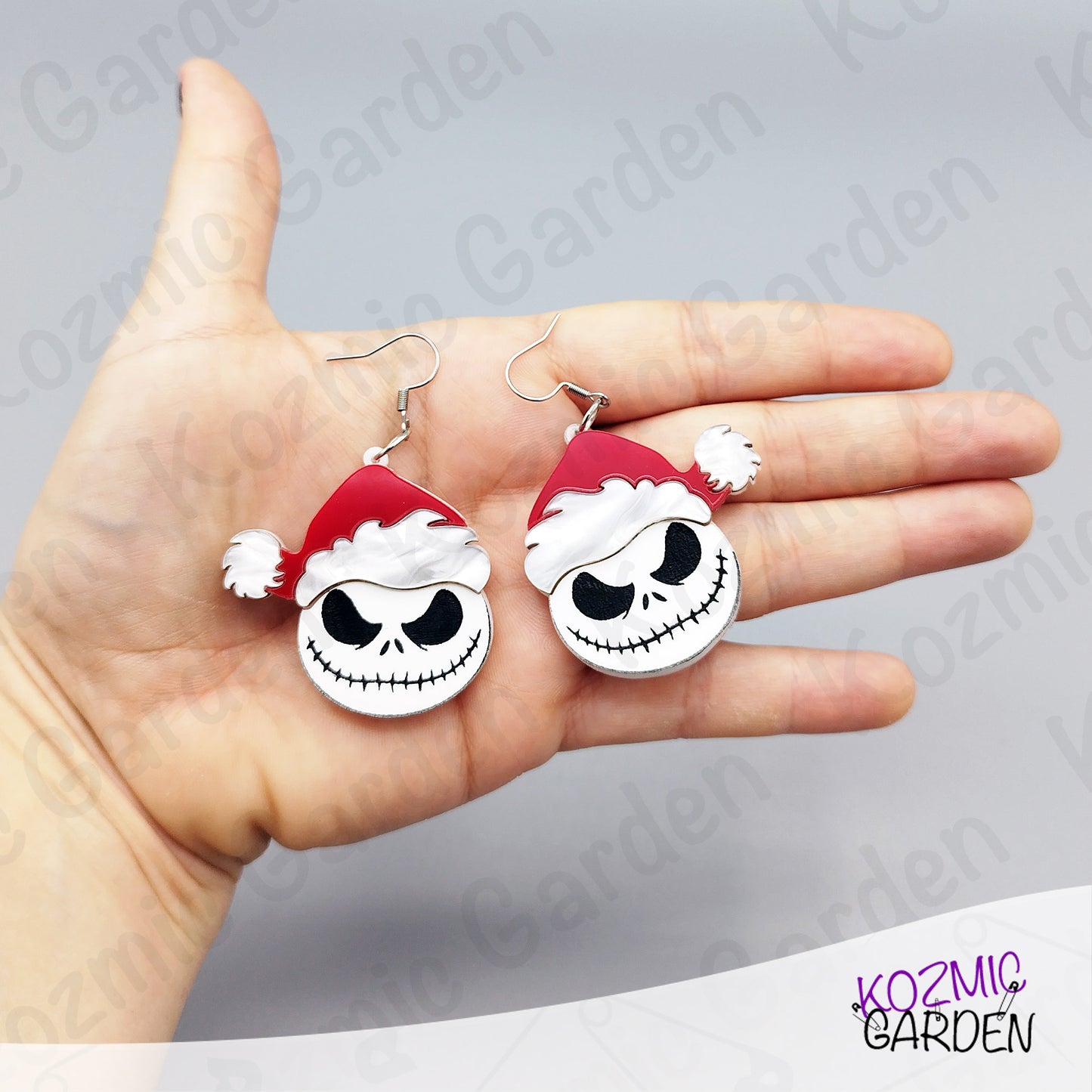 Jack Santa earrings styled with holiday décor. Perfect mashup of Nightmare-style Halloween and merry Christmas fun.