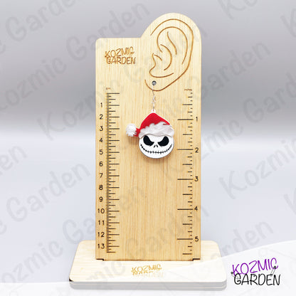 Spooky Christmas earrings worn on ear. Fun gothic holiday accessory for fans of dark, alternative fashion and Halloween lovers.
