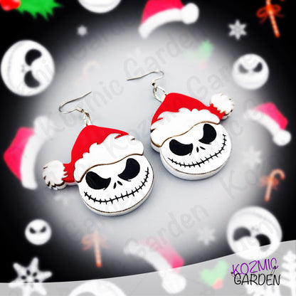 Handmade acrylic earrings featuring a Jack Skellington wearing a Santa hat, inspired by a Halloween and Christmas mashup. Festive gothic jewelry by Kozmic Garden.